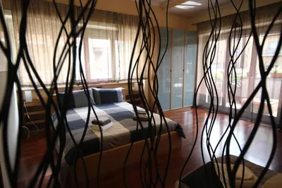 a bedroom with a bed and someookyooky plants at AnnoDomini in Rome