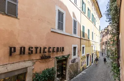 a street in the old town ofzzazzizzizzizzizzizziolioli at Trastevere Apartments in Rome