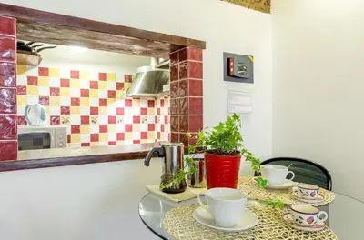 a glass table with two cups on top of it at Trastevere Apartments in Rome