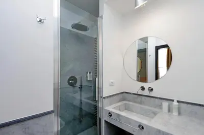 a bathroom with a sink and a mirror at Colonna 32 in Rome