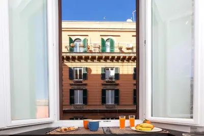 an open window with a view of a building at Boutique Domus Trastevere Bertani in Rome