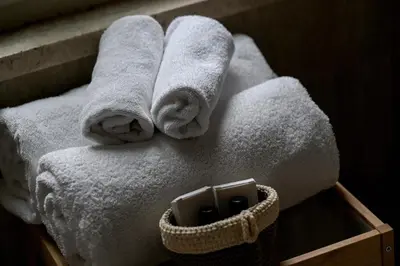 a pile of towels sitting on top of a table at Vicolo 22 - Residenze Romanae in Rome