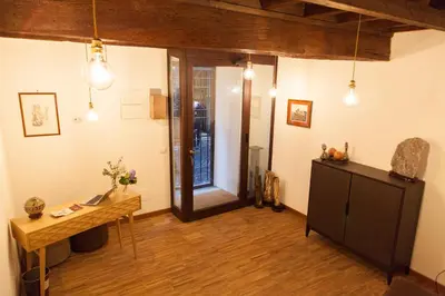 a room with a desk and a table in a room at Vicolo 22 - Residenze Romanae in Rome