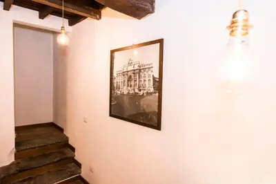 a picture of a building hanging on a wall at Vicolo 22 - Residenze Romanae in Rome