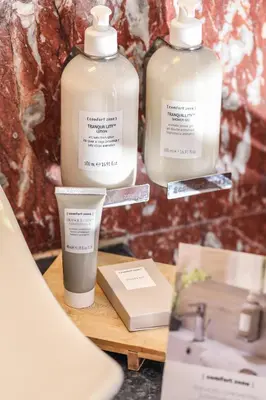a couple of bottles of soap on a table at Spagna Dream Suites in Rome