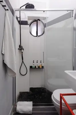 a bathroom with a shower with a toilet and a sink at Vicoloft Sales in Rome