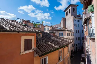 an alley in the city with buildings at Home D'elite Navona in Rome
