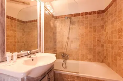 a bathroom with a sink and a shower and a tub at Home D'elite Navona in Rome