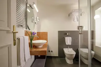 a bathroom with a sink and a toilet at Vivaldi Luxury Rooms in Rome