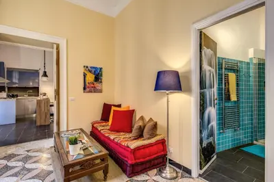 a living room with a couch and a table at Cavour Colloseum suite in Rome