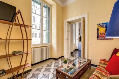 a living room with a couch and a table at Cavour Colloseum suite in Rome