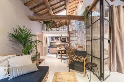 a living room with a couch and a table at Loft&Terrace - Elevated Elegance at Navona in Rome