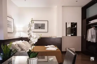 a living room with a table and a couch at Hotel Boutique Nazionale in Rome