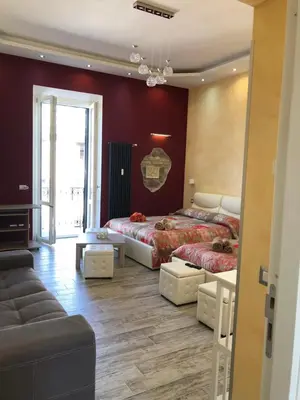 a bedroom with a large bed and a couch at Vatican Garden in Rome