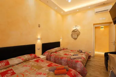 a bedroom with two beds in a room at Vatican Garden in Rome