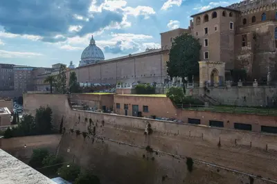 a view of a city with a building and a dome at Vatican Garden in Rome