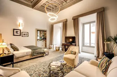 a large living room with a bed and a couch at Martius Private Suites Hotel in Rome