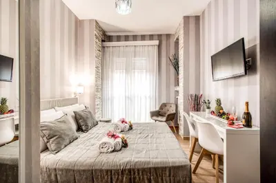 a bedroom with a bed with stuffed animals on it at Santamaggiore in Rome