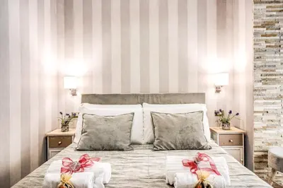 a bedroom with a bed with two bows on it at Santamaggiore in Rome