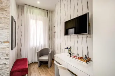 a living room with a tv on a wall at Santamaggiore in Rome