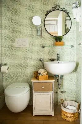 a bathroom with a sink and a toilet and a mirror at Santamaggiore in Rome