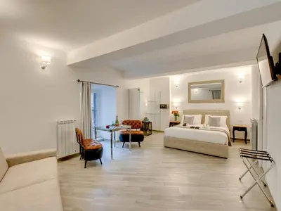a hotel room with a bed and a table at Roma Suites Navona in Rome