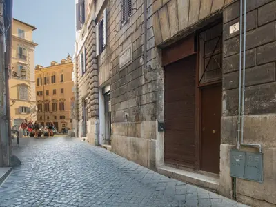 a cobblestone street in a city with buildings at Roma Suites Navona in Rome