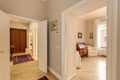 an open hallway with a room with a piano at Lovely Flat by the Vatican in Rome