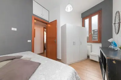 a bedroom with a bed and a desk in a room at Mondrian House in Rome