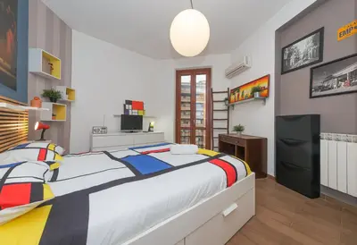 a bedroom with a large bed in a room at Mondrian House in Rome