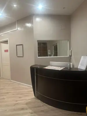 a salon with a black counter and a mirror at Liberty Vatican Suites - Liberty Collection in Rome