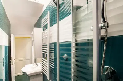 a bathroom with a shower and a sink at Rome Best Rent in Rome