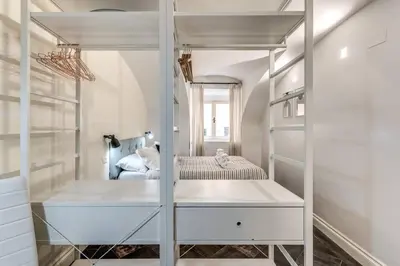 a dressing room with a mirror and a bed at Fori Imperiali Apartment in Rome