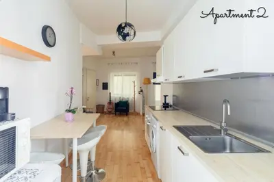 a kitchen with a sink and a counter top at PennyLane Rome Apartment in Rome