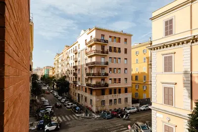 a view of a city street with buildings and cars at PennyLane Rome Apartment in Rome