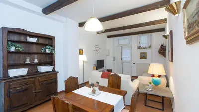 a living room with a table and a dining room at Rental in Rome Panieri Terrace in Rome