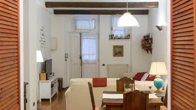 a living room with a couch and a table in a room at Rental in Rome Panieri Terrace in Rome