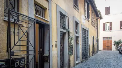 an alley in an old building with a door at Rental in Rome Panieri Terrace in Rome