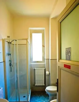 a bathroom with a shower and a toilet at B&B Bel Ami in Rome