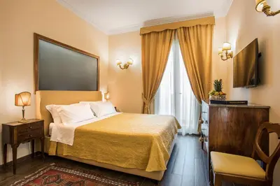 a hotel room with a bed and a television at Alta Luxury Apartments - Oca Apartment in Rome