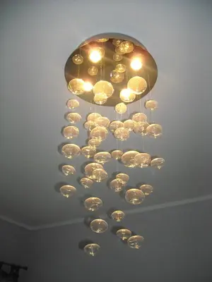 a large chandelier hanging from a ceiling at B&B Il Granello Di Senape in Rome