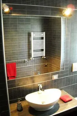 a bathroom with a sink and a mirror at B&B Il Granello Di Senape in Rome