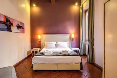 a bedroom with a bed in a room at Guest House o Affittacamere Magenta Fico 2 in Rome
