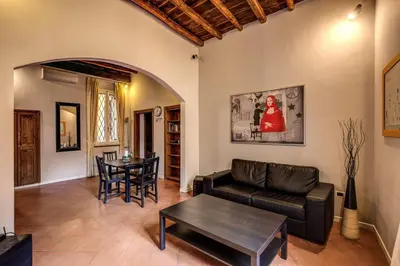 a living room with a couch and a table at Guest House o Affittacamere Magenta Fico 2 in Rome