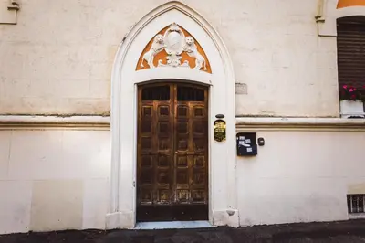 an entrance to a building with a wooden door at Angelina Rooms in Rome in Rome