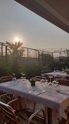 a group of tables with wine glasses on them at Hotel Casa Valdese Roma in Rome