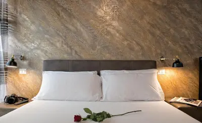 a bedroom with a large bed with white pillows at StarHome Navona in Rome