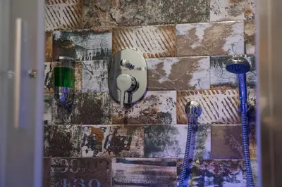 a wall with two toothbrushes on it at StarHome Navona in Rome