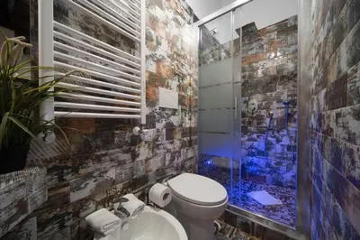 a bathroom with a toilet and a sink at StarHome Navona in Rome