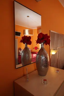 two vases sitting on a table in front of a mirror at Roma Gianicolense in Rome